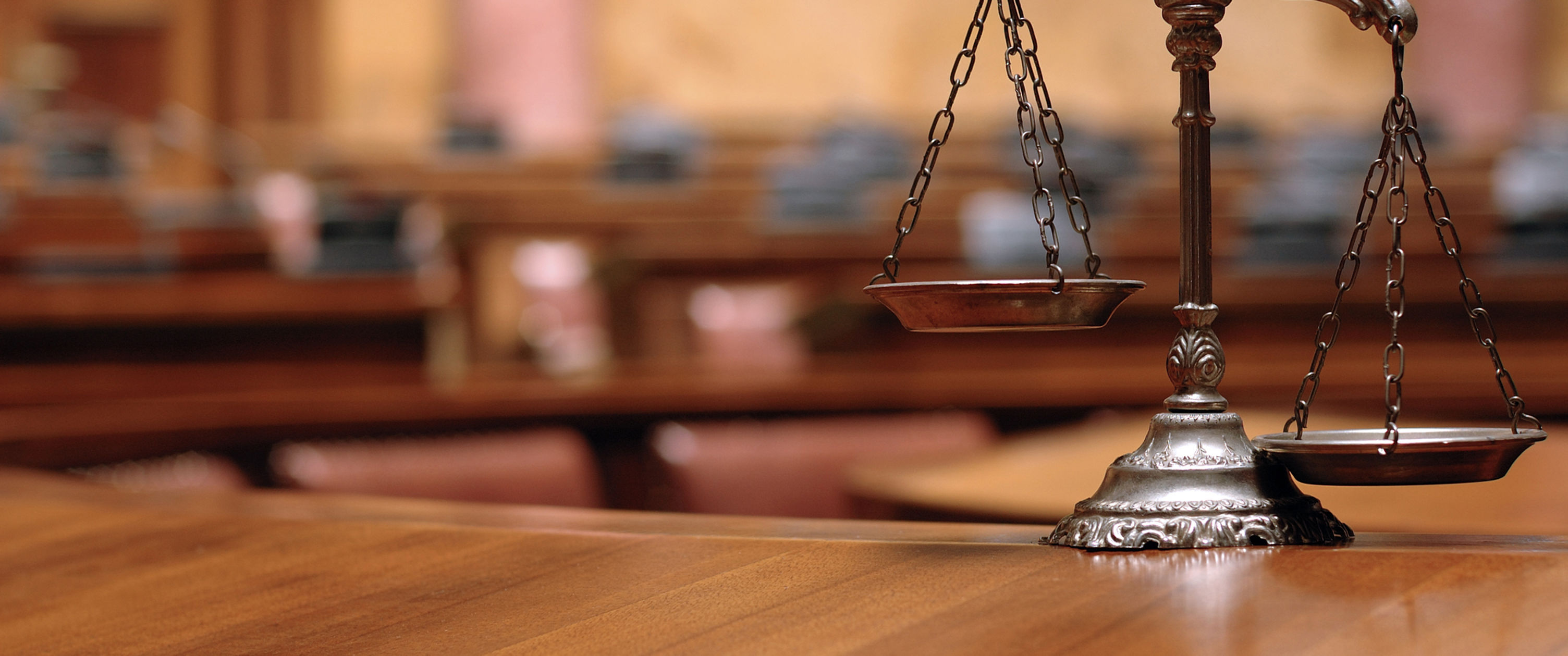 Symbol of law and justice in the empty courtroom