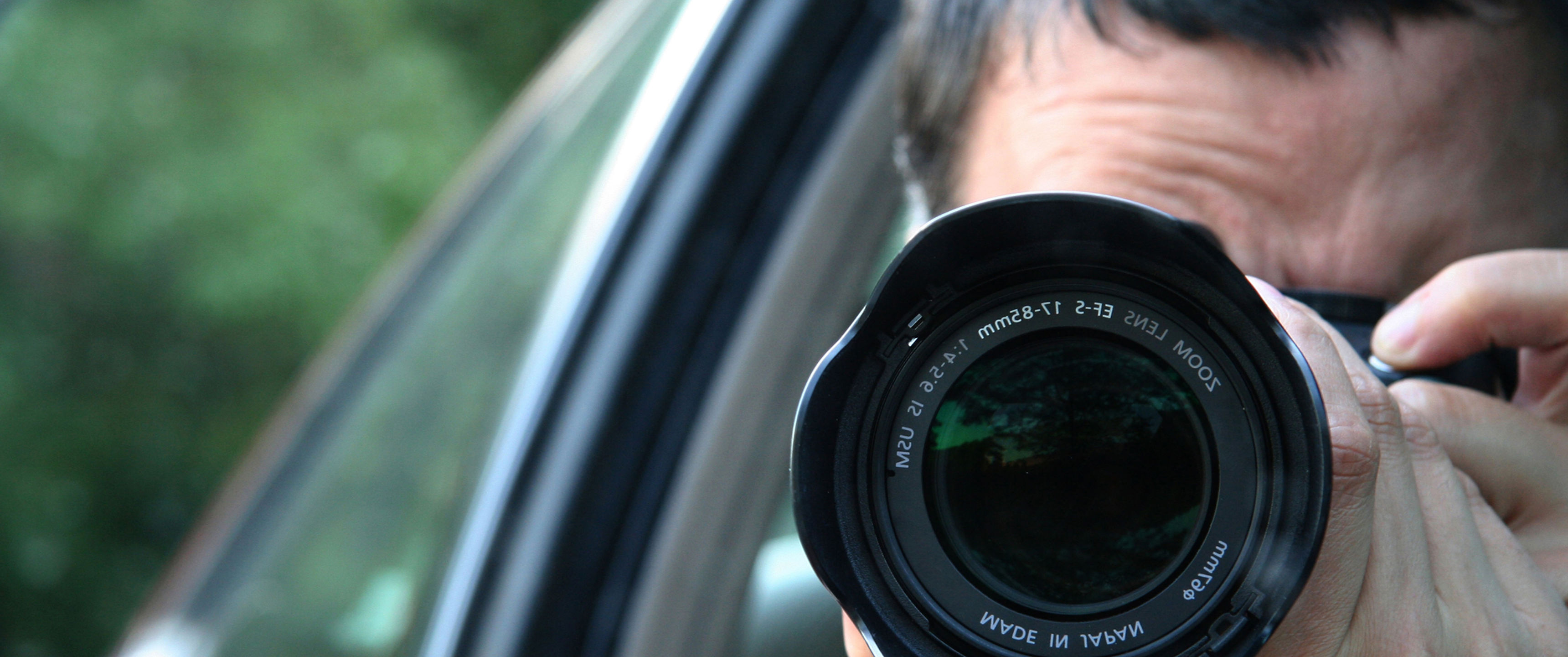Paparazzi taking photo from car